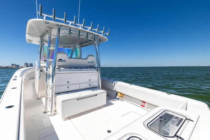 Slide: The Image of 2021 Contender 39FA Fish Around boat on open water, clear blue sky. - 31