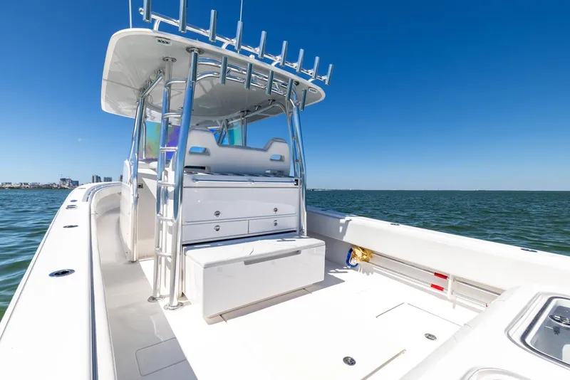 Slide: The Image of 2021 Contender 39FA Fish Around boat on open water, clear sky background. - 32