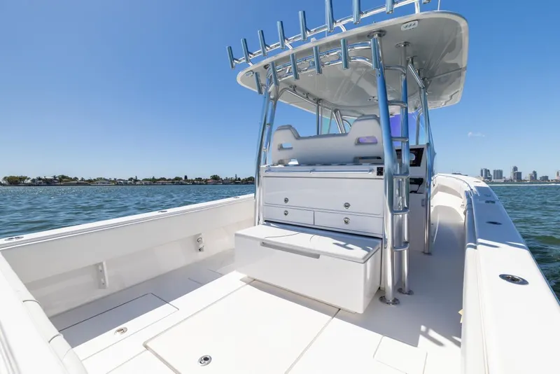 Slide: The Image of 2021 Contender 39FA Fish Around boat on water with city skyline in background. - 34