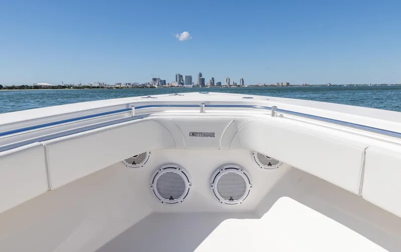 Slide: The Image of 2021 Contender 39FA Fish Around boat with city skyline in the background. - 39