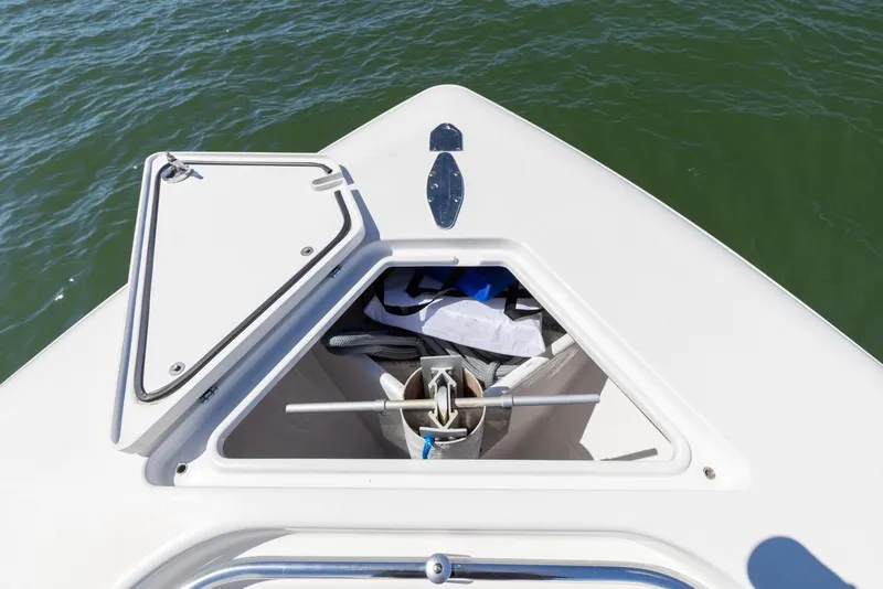 Slide: The Image of Open storage compartment on 2021 Contender 39FA Fish Around boat. - 40