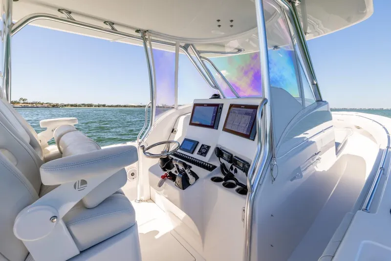 Slide: The Image of 2021 Contender 39FA Fish Around boat interior with modern navigation system. - 45