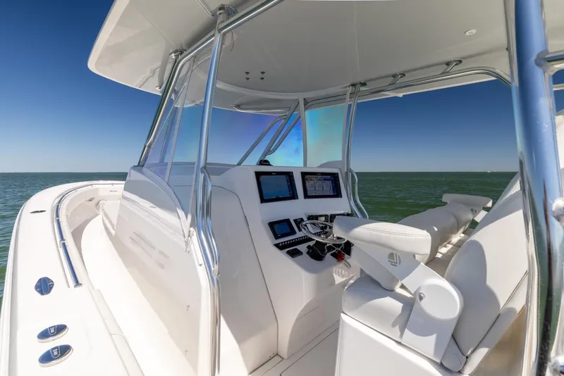 Slide: The Image of 2021 Contender 39FA Fish Around boat cockpit with advanced navigation systems. - 47