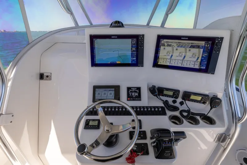 Slide: The Image of 2021 Contender 39FA Fish Around helm with advanced navigation and control systems. - 48