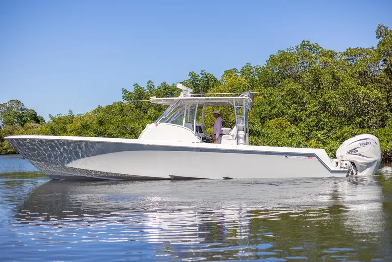 Slide: The Image of 2021 Contender 39FA Fish Around boat cruising on calm water. - 8