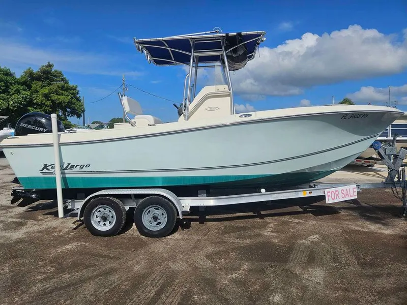 The Image of 2014 Key Largo 2100 boat on trailer, for sale under clear blue sky. - 0