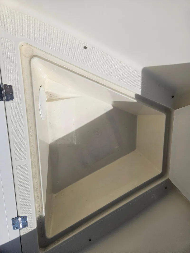 Slide: The Image of Key Largo 2100 boat storage compartment, 2014 model, open and empty. - 13