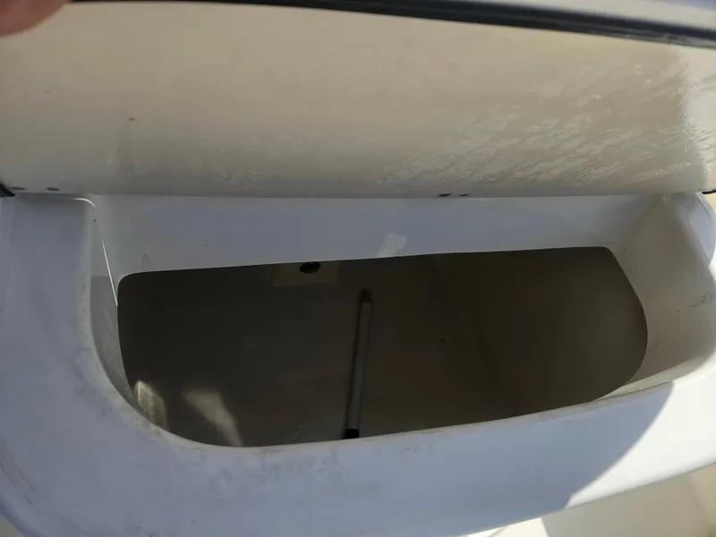 Slide: The Image of Open storage compartment on a 2014 Key Largo 2100 boat. - 16