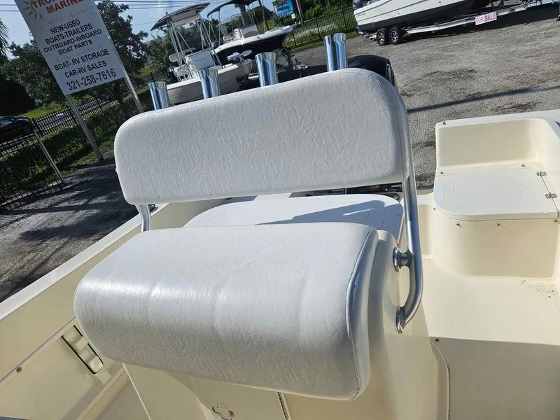 Slide: The Image of White cushioned seat on 2014 Key Largo 2100 boat, outdoor setting. - 20