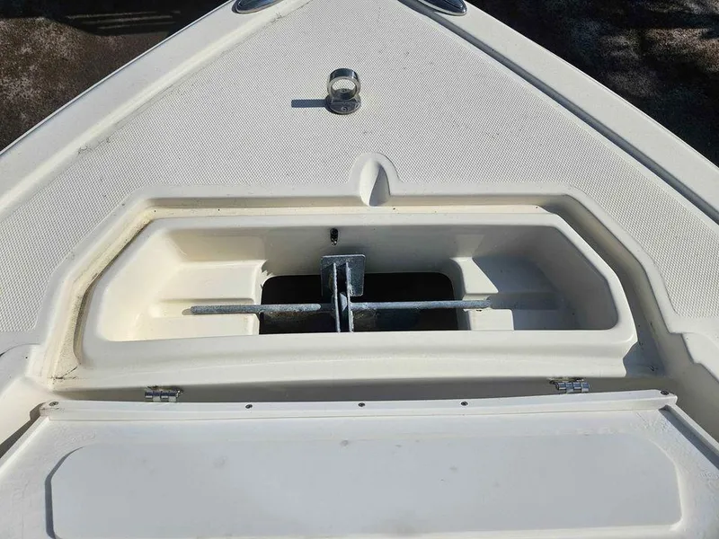 Slide: The Image of 2014 Key Largo 2100 boat anchor compartment, open and empty. - 21