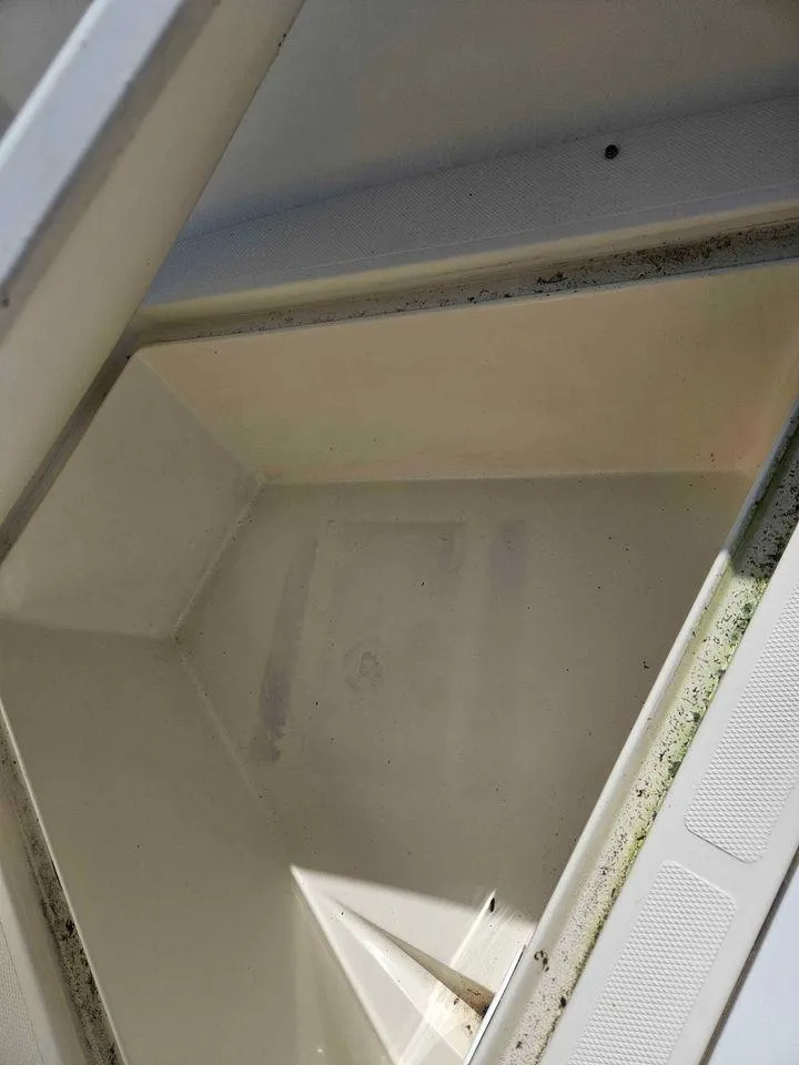 Slide: The Image of Open storage compartment of 2014 Key Largo 2100 boat. - 22