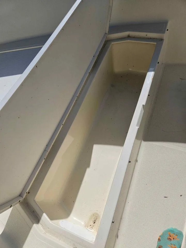 Slide: The Image of Open storage compartment on 2014 Key Largo 2100 boat. - 23