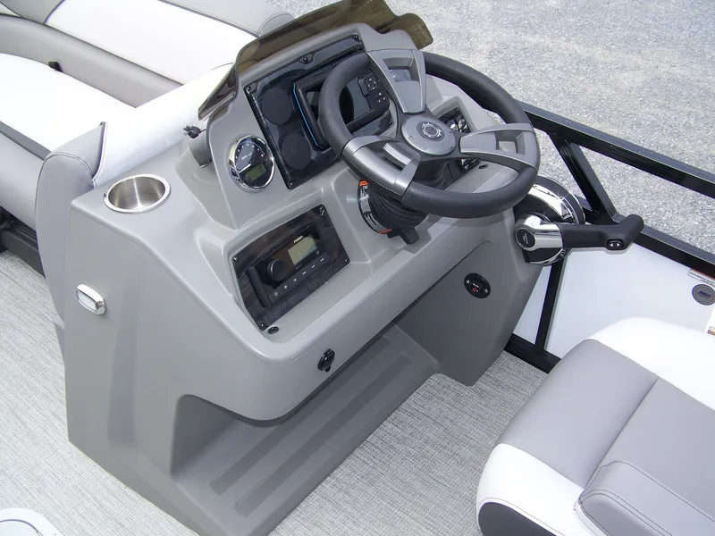 Slide: The Image of 2024 Avalon VENTURE 85 QL boat dashboard with steering wheel and controls. - 7