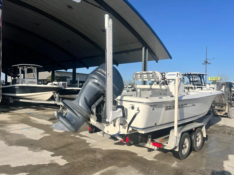 Slide: The Image of 2013 Sea Hunt BX 22 Pro boat on trailer with Yamaha outboard motor. - 4