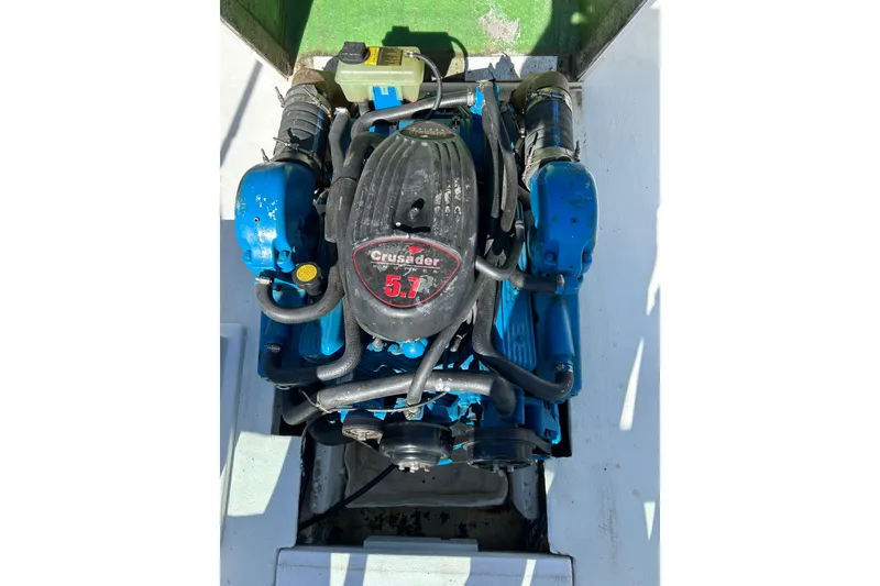 Slide: The Image of 1978 Lyman 24 Sportsman boat engine, Crusader 5.7, blue components, top view. - 16