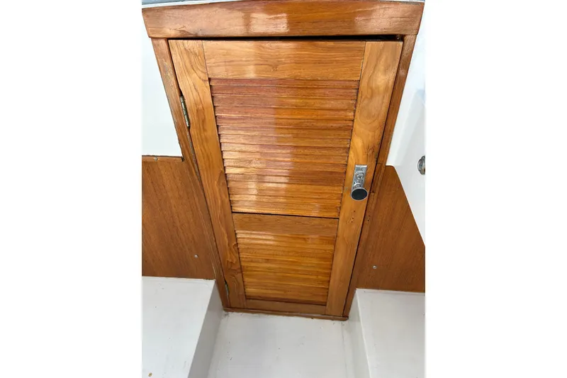 Slide: The Image of Wooden cabin door on a 1978 Lyman 24 Sportsman boat. - 20