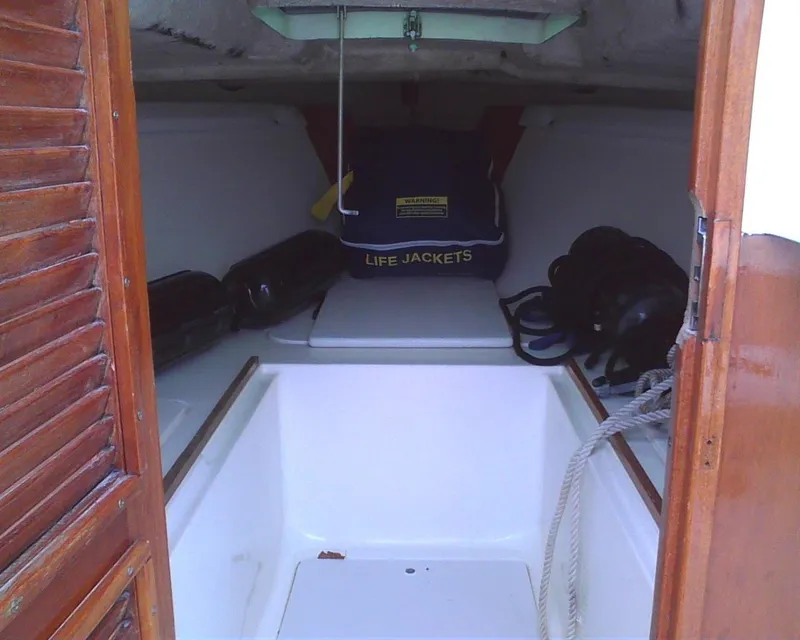 Slide: The Image of Interior of a 1978 Lyman 24 Sportsman boat with life jackets and ropes. - 9