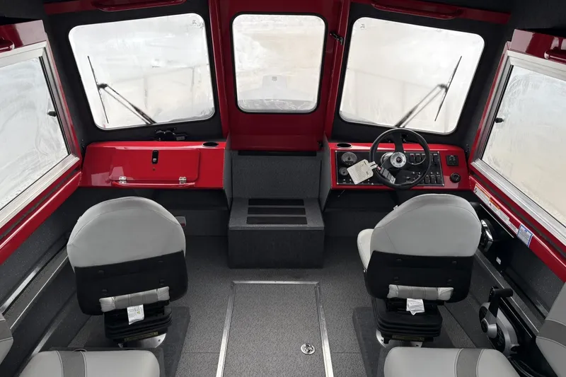 Slide: The Image of Interior of 2024 Spartan 240 Maximus Pro boat with dual seats and steering console. - 11