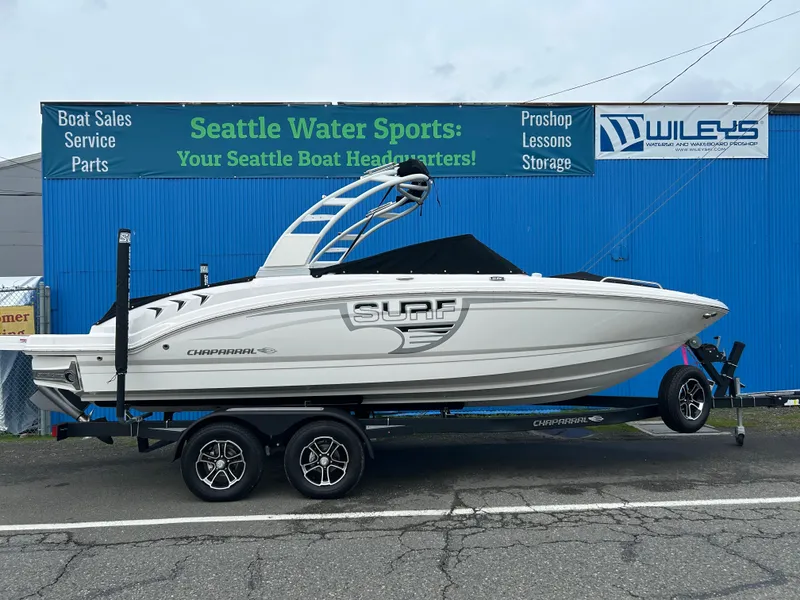 The Image of 2024 Chaparral 23 Surf boat on trailer at Seattle Water Sports dealership. - 0