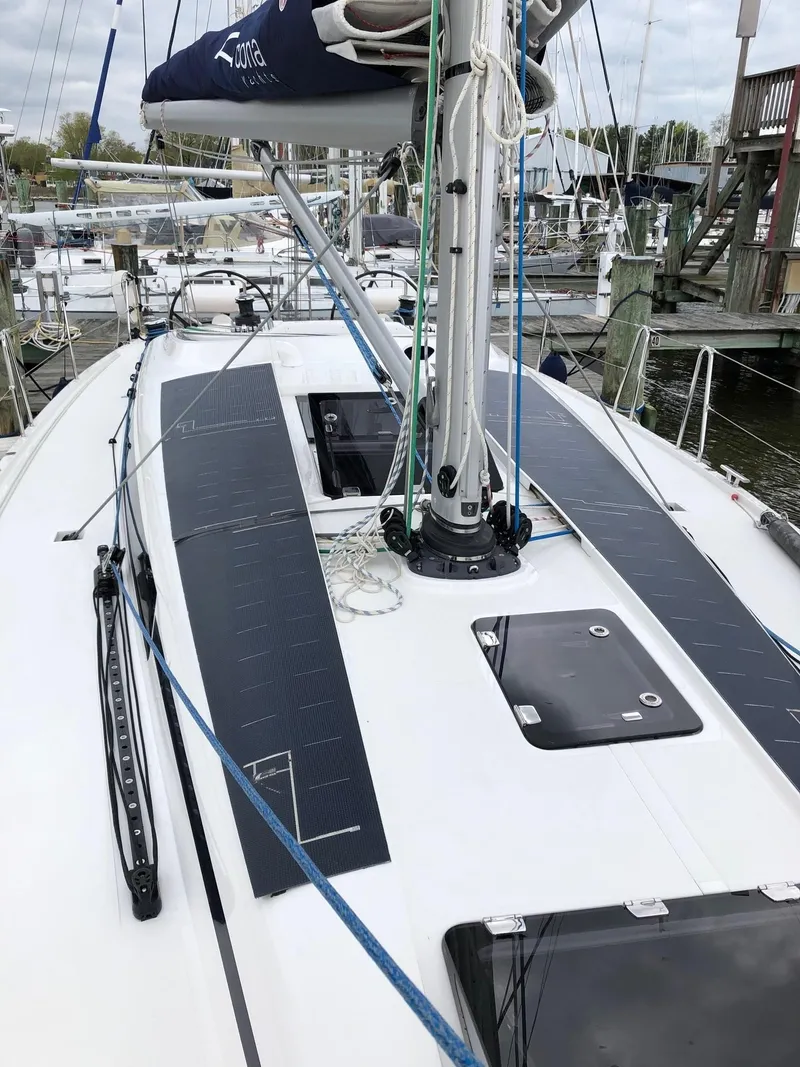 Slide: The Image of 2020 Arcona 435 sailboat deck with solar panels and rigging in a marina. - 24