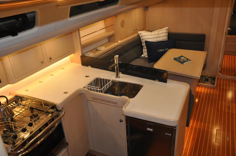 Slide: The Image of Interior of 2020 Arcona 435 yacht with modern kitchen and cozy seating area. - 27