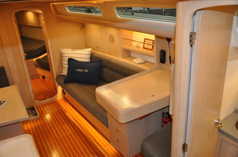 Slide: The Image of 2020 Arcona 435 yacht interior with cozy seating and wooden flooring. - 29