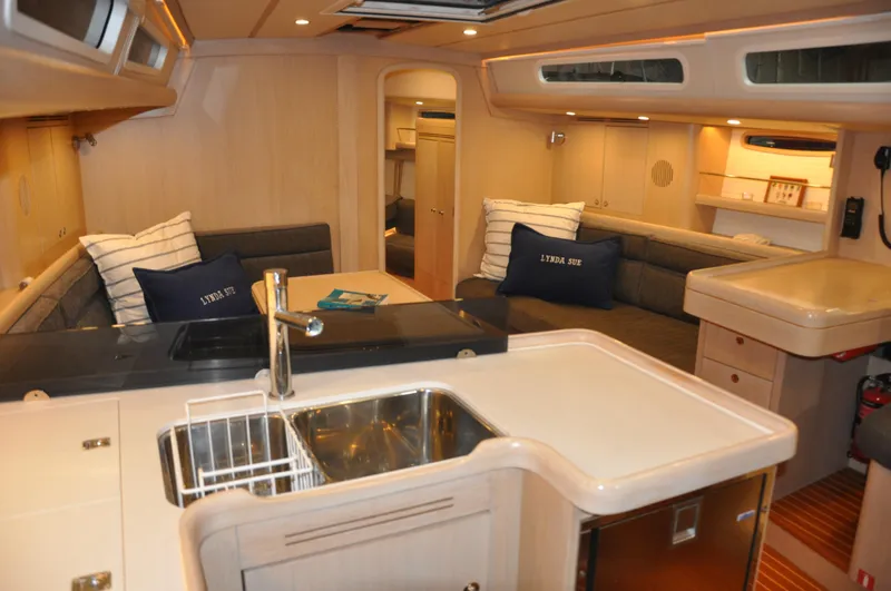 Slide: The Image of Interior of 2020 Arcona 435 yacht with modern kitchen and cozy seating area. - 31