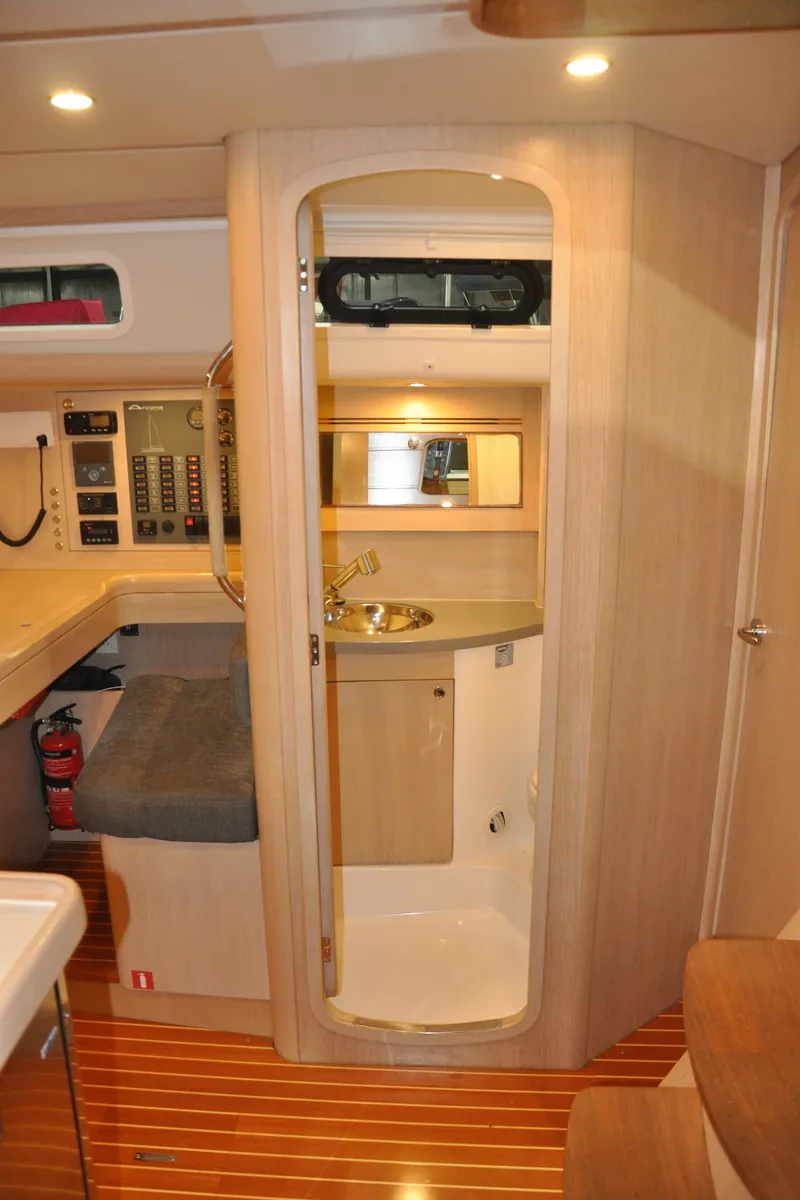 Slide: The Image of 2020 Arcona 435 yacht interior with modern wood finish and compact bathroom. - 33