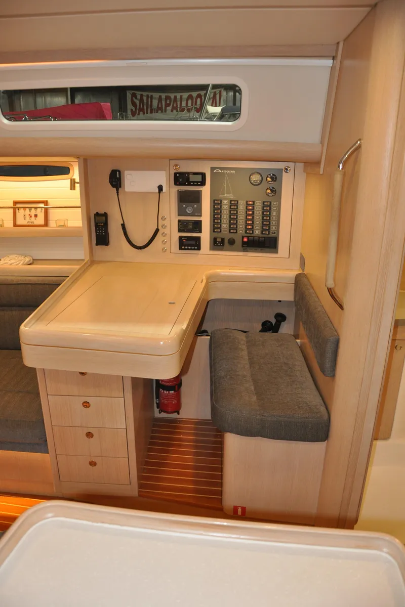 Slide: The Image of 2020 Arcona 435 yacht interior with navigation station and control panel. - 34