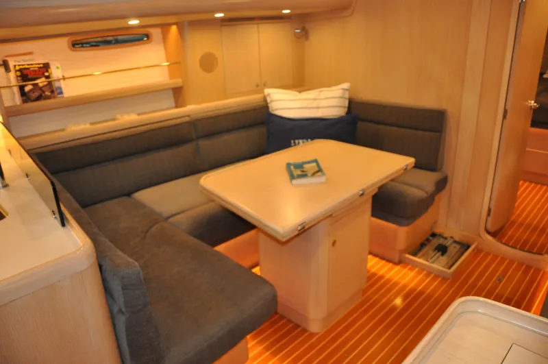 Slide: The Image of Interior of 2020 Arcona 435 yacht with cozy seating and wooden table. - 37
