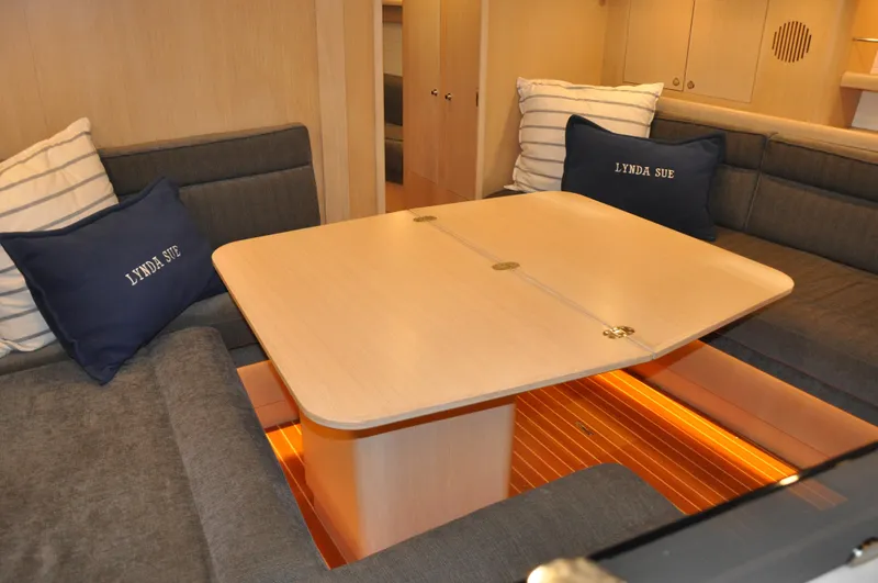 Slide: The Image of Interior of 2020 Arcona 435 yacht with cozy seating and wooden table. - 41