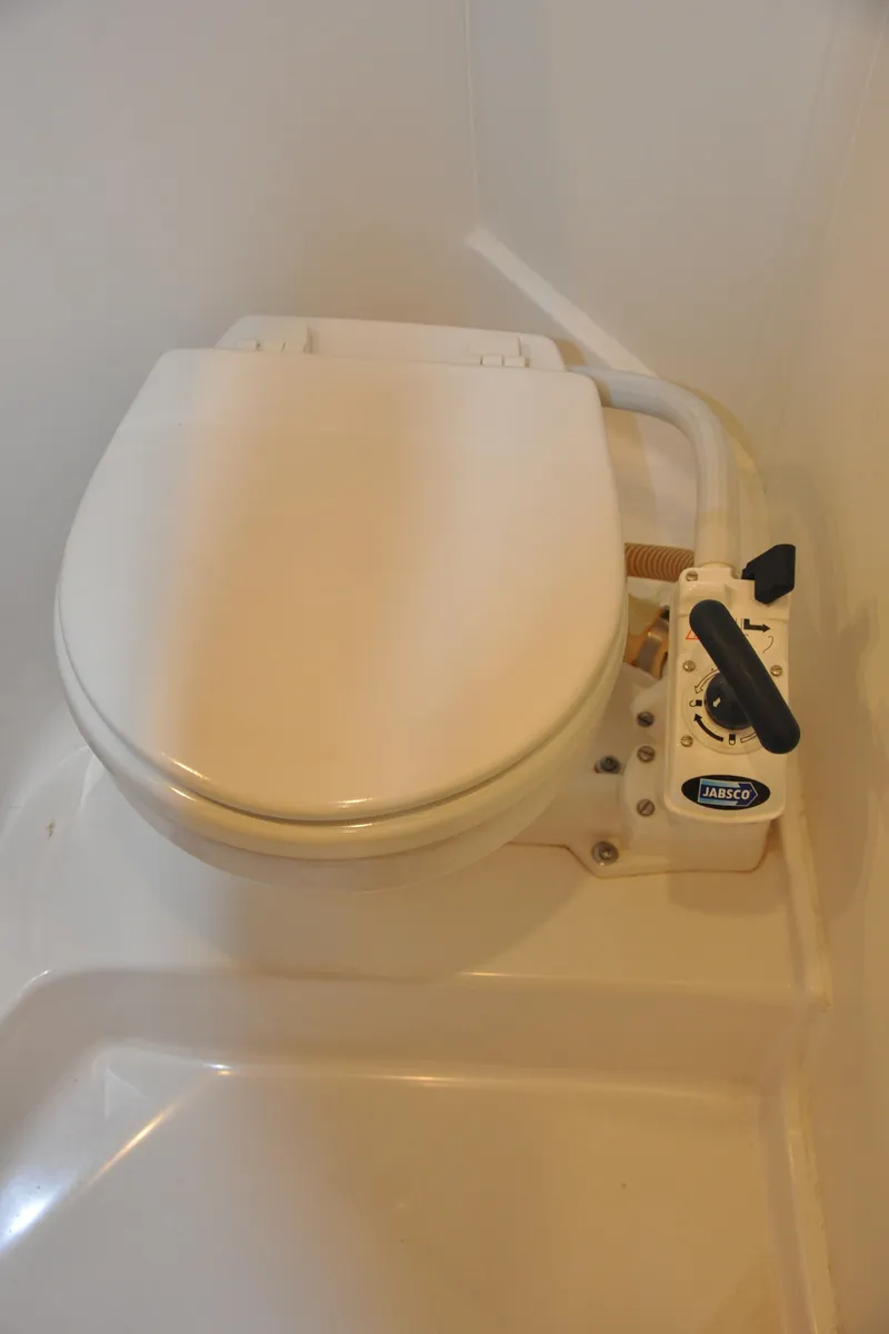 Slide: The Image of 2020 Arcona 435 marine toilet with manual flush system. - 47
