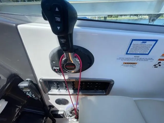 Slide: The Image of Control panel of a 2019 Monterey 295 boat with throttle and trim controls. - 21