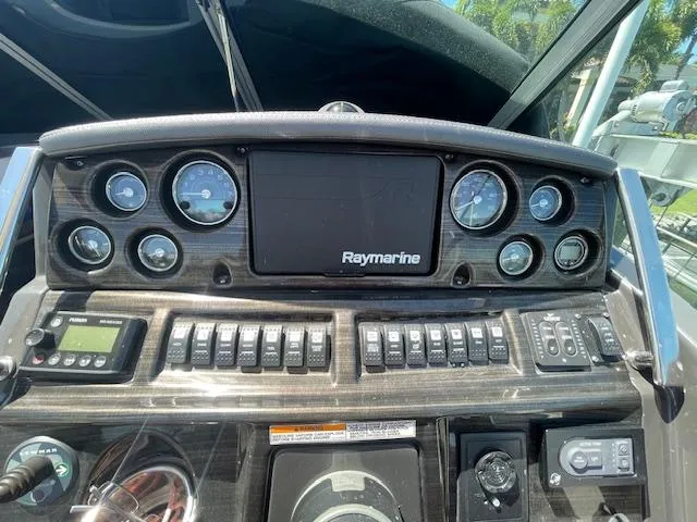 Slide: The Image of Control panel of a 2019 Monterey 295 boat with Raymarine display and gauges. - 22
