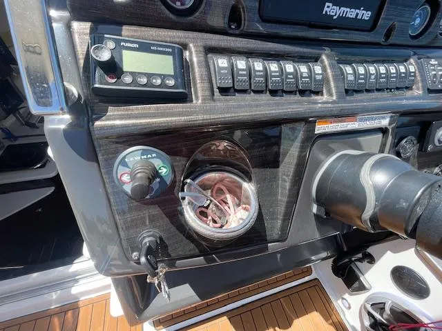 Slide: The Image of Control panel of a 2019 Monterey 295 boat with navigation and audio systems. - 24