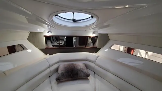 Slide: The Image of Luxurious interior of a 2019 Monterey 295 yacht with plush seating and skylight. - 29