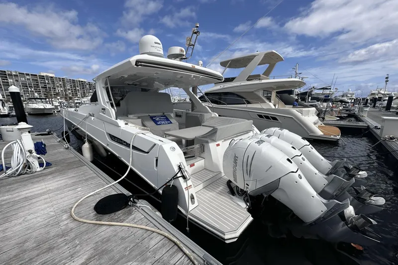 Slide: The Image of Azimut 40 Verve 2020 yacht docked at marina with twin outboard engines. - 14