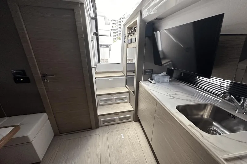 Slide: The Image of Interior of 2020 Azimut 40 Verve yacht with modern kitchen and sleek design. - 23