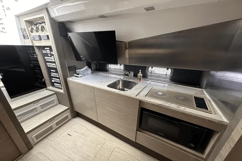 Slide: The Image of Modern kitchen interior of 2020 Azimut 40 Verve yacht with appliances and sleek design. - 24