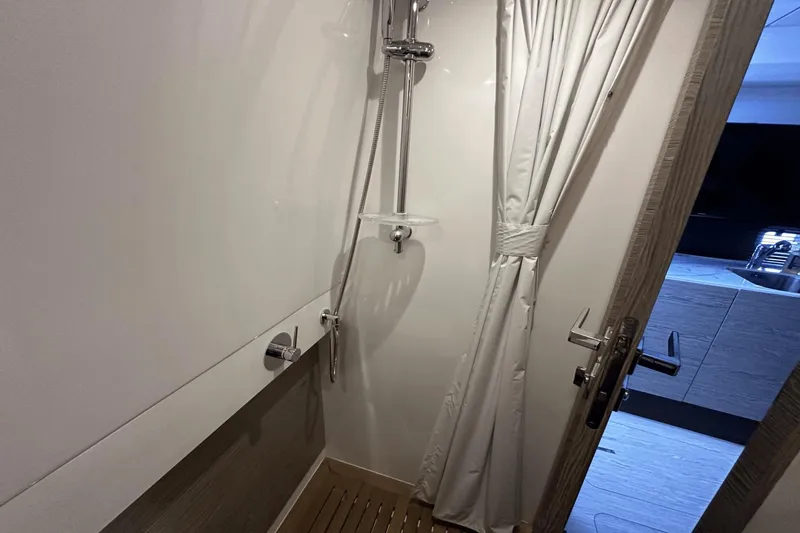 Slide: The Image of Shower area in 2020 Azimut 40 Verve yacht, featuring modern fixtures and curtain. - 30