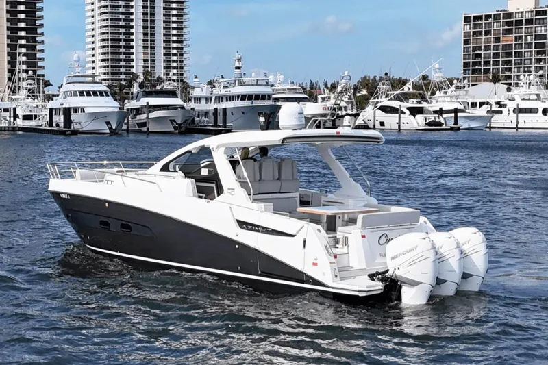 Slide: The Image of Azimut 40 Verve 2020 yacht cruising in marina with skyscrapers in background. - 4