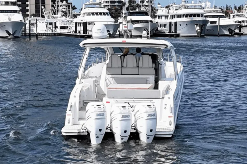 Slide: The Image of Azimut 40 Verve 2020 yacht cruising in a marina with multiple boats docked. - 7