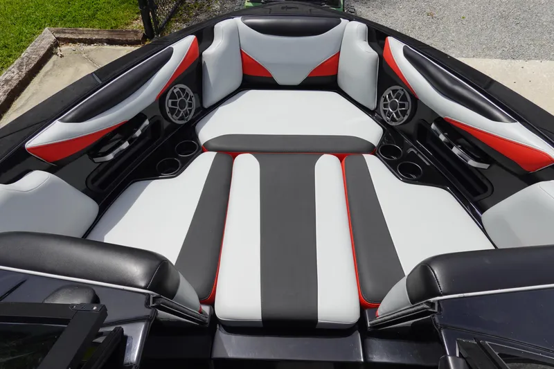 Slide: The Image of 2019 Axis T22 boat interior with red, black, and white seating. - 11