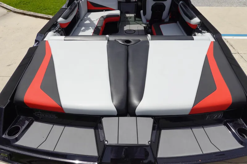 Slide: The Image of 2019 Axis T22 boat interior with red, black, and white upholstery. - 12