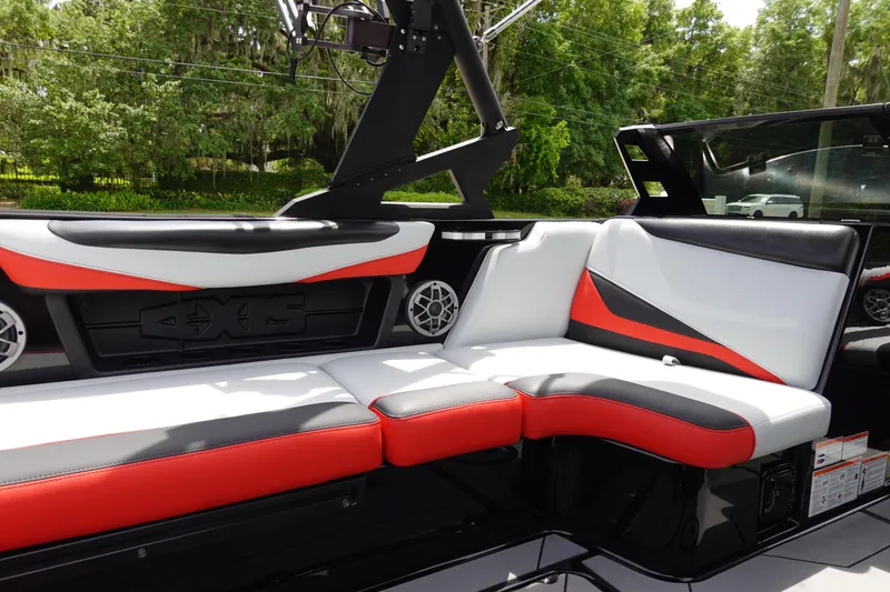 Slide: The Image of 2019 Axis T22 boat interior with red, white, and black seating. - 16