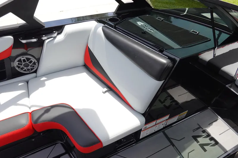 Slide: The Image of 2019 Axis T22 boat interior with white, black, and red seating. - 18