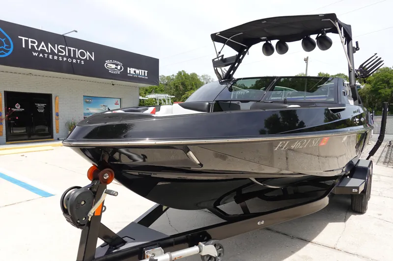Slide: The Image of 2019 Axis T22 boat on trailer at Transition Watersports dealership. - 2