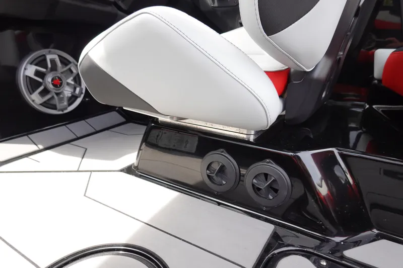 Slide: The Image of 2019 Axis T22 boat interior with white and black seating and speaker system. - 20