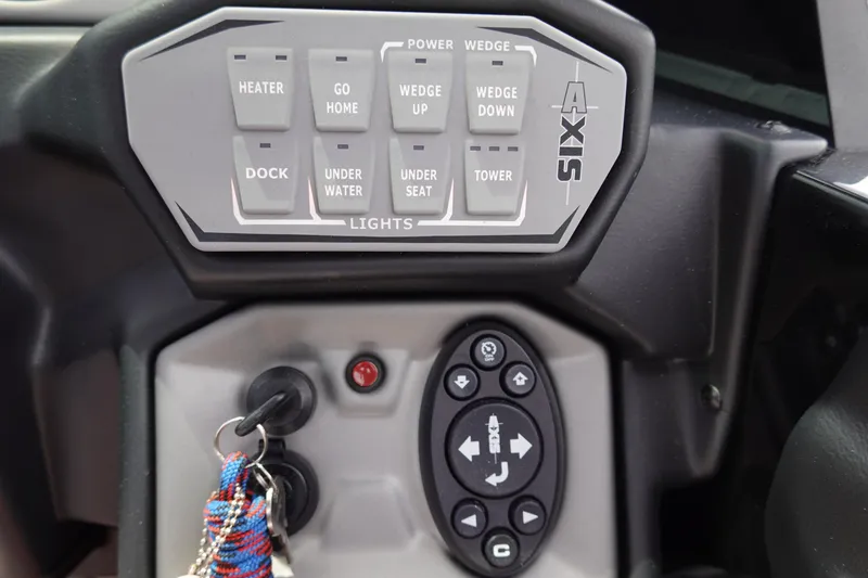 Slide: The Image of Control panel of a 2019 Axis T22 boat with various function buttons. - 25