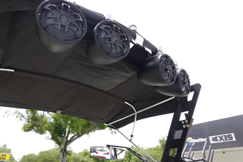 Slide: The Image of 2019 Axis T22 boat with mounted speakers and canopy. - 27